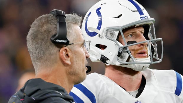 Oct 11, 2021; Baltimore, Maryland, USA; Indianapolis Colts head coach Frank Reich (L) talks with Colts quarterback Carson Wentz (2) on the sidelines against the Baltimore Ravens at M&T Bank Stadium.