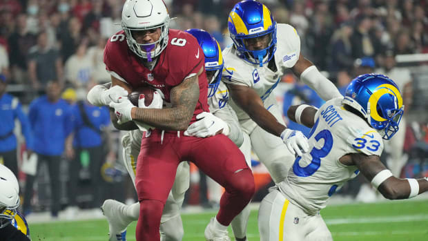 Cardinals running back James Conner (6) is tackled by Los Angeles Rams linebacker Ernest Jones (50) during the first quarter at State Farm Stadium.