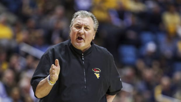 Mar 7, 2020; Morgantown, West Virginia, USA; West Virginia Mountaineers head coach Bob Huggins reacts during the first half against the Baylor Bears at WVU Coliseum.