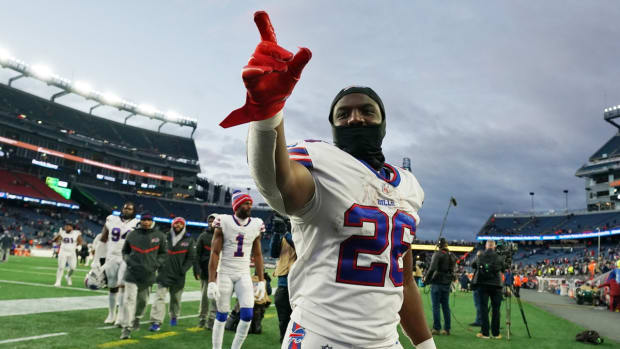 Dec 26, 2021; Foxborough, Massachusetts, USA; Buffalo Bills running back Devin Singletary (26) reacts to the crowd after defeating the New England Patriots at Gillette Stadium. Mandatory Credit: David Butler II-USA TODAY Sports