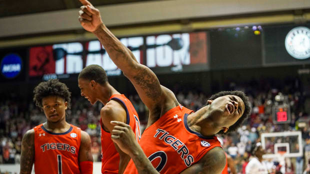 Auburn guard K.D. Johnson (0) reacts after a play against Alabama during the second half at Coleman Coliseum.