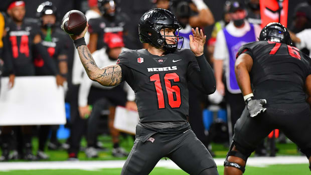 Tate Martell attempts to throw a pass with UNLV.