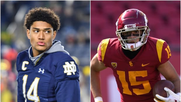 Notre Dame safety Kyle Hamilton with USC wide receiver Drake London