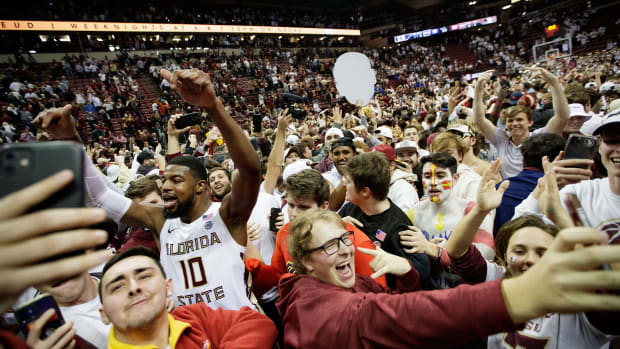 Florida State Seminoles forward Malik Osborne (10) celebrates with fanswho stormed the court after the Seminoles defeated the Duke Blue Devils 79-78 in overtime at the Donald L. Tucker Civic Center on Tuesday, Jan. 18, 2022. Fsu V Duke Second Half1261