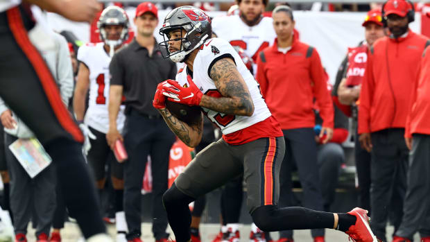 Jan 16, 2022; Tampa, Florida, USA; Tampa Bay Buccaneers wide receiver Mike Evans (13) runs with the ball against the Philadelphia Eagles during the second half in a NFC Wild Card playoff football game at Raymond James Stadium.