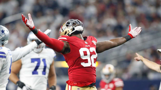 Jan 16, 2022; Arlington, Texas, USA;San Francisco 49ers defensive end Charles Omenihu (92) reacts after making a sack in the third quarter against the Dallas Cowboys in a NFC Wild Card playoff football game at AT&T Stadium.