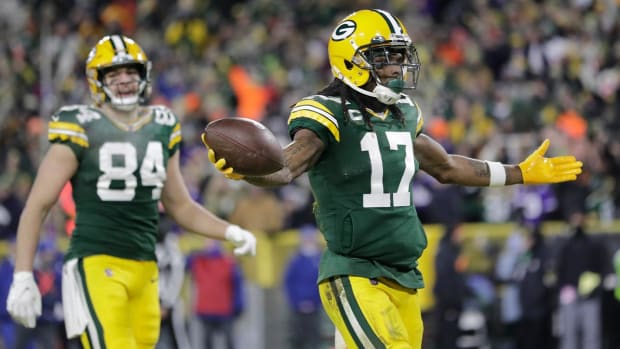 Green Bay Packers' Davante Adams reacts after catchiong a touchdown pass during the first half of an NFL football game against the Minnesota Vikings Sunday, Jan. 2, 2022, in Green Bay, Wis.