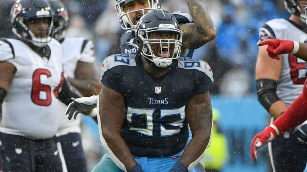Tennessee Titans defensive tackle Teair Tart (93) celebrates the tackle for loss against the Houston Texans during the first half at Nissan Stadium.