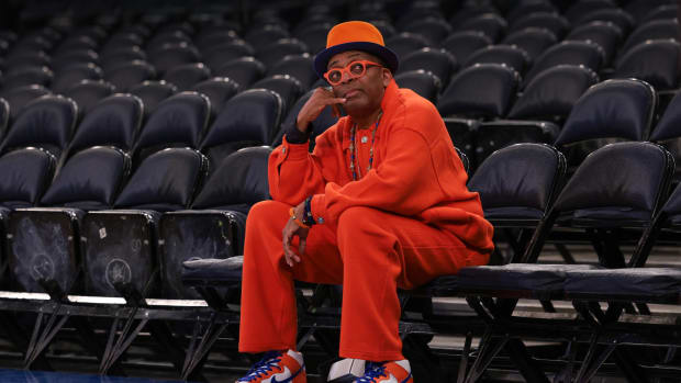 American actor and director Spike Lee looks up during warmups before a game between the New York Knicks and the Golden State Warriors at Madison Square Garden.