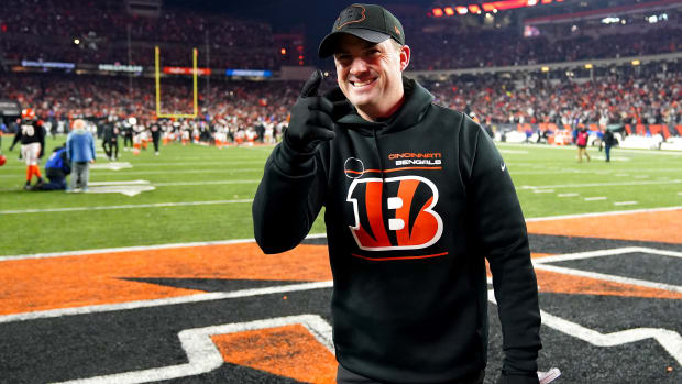 Bengals coach Zac Taylor walks off the field after beating the Raiders in the playoffs
