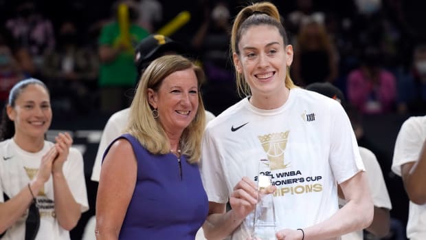 Aug 12, 2021; Phoenix, Arizona, USA; WNBA commissioner Cathy Engelbert and Seattle Storm forward Breanna Stewart (30) pose with the MVP trophy after a victory by Seattle over the Connecticut Sun during the Inaugural WNBA Commissioners Cup Championship Game at Footprint Center.
