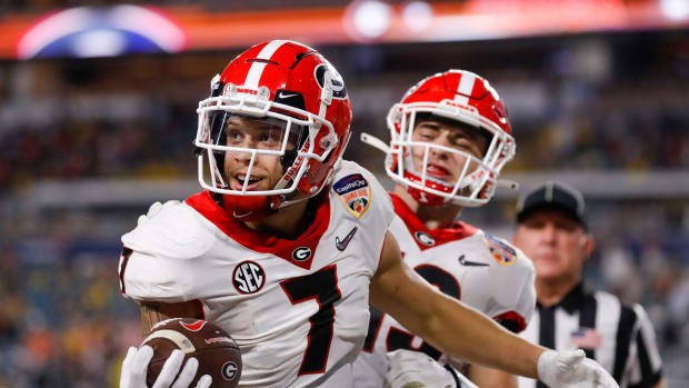 Georgia Bulldogs wide receiver Jermaine Burton (7) celebrates in the end zone after scoring a touchdown against the Michigan Wolverines in the second quarter during the Orange Bowl college football CFP national semifinal game at Hard Rock Stadium.