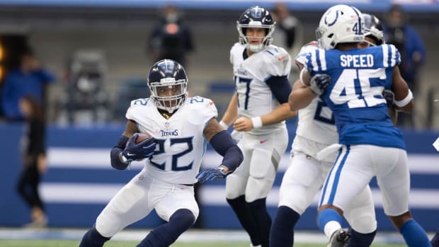 Oct 31, 2021; Indianapolis, Indiana, USA; Tennessee Titans running back Derrick Henry (22) runs the ball in the second half against the Indianapolis Colts at Lucas Oil Stadium.