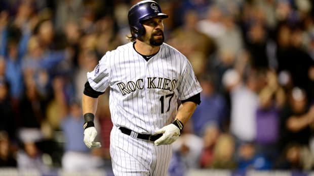 May 31, 2013; Denver, CO, USA; Colorado Rockies first baseman Todd Helton (17) reacts to his home run in the ninth inning against the Los Angeles Dodgers at Coors Field. The Dodgers defeated the Rockies 7-5 in ten innings.