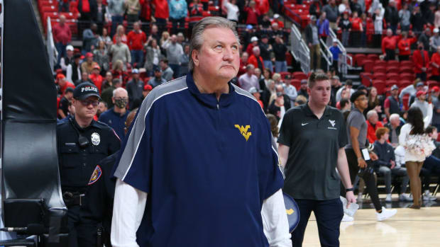 Jan 22, 2022; Lubbock, Texas, USA; West Virginia Mountaineers head coach Bob Huggins enters the United Supermarkets Arena before the game against the Texas Tech Red Raiders. Mandatory Credit:
