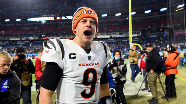 Jan 22, 2022; Nashville, Tennessee, USA; Cincinnati Bengals quarterback Joe Burrow (9) celebrates after the Bengals defeated the Tennessee Titans 19-16 in the AFC Divisional playoff football game at Nissan Stadium. Mandatory Credit: Christopher Hanewinckel-USA TODAY Sports