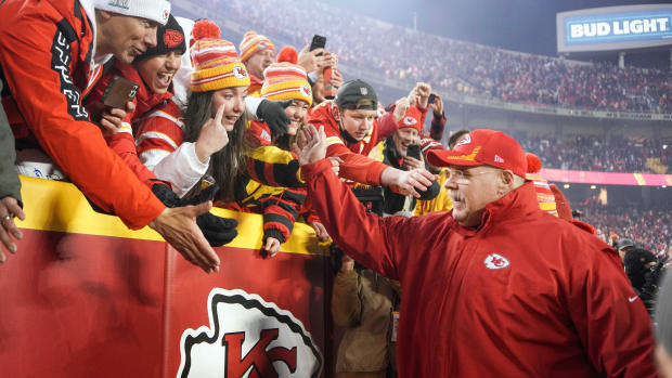 Jan 23, 2022; Kansas City, Missouri, USA; Kansas City Chiefs head coach Andy Reid celebrates with fans after the win against the Buffalo Bills in overtime in the AFC Divisional playoff football game at GEHA Field at Arrowhead Stadium. Mandatory Credit: Denny Medley-USA TODAY Sports