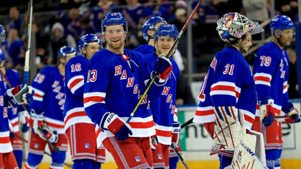 Jan 22, 2022; New York, New York, USA; New York Rangers defenseman Adam Fox (23) celebrates after a 7-3 victory against the Arizona Coyotes at Madison Square Garden. Mandatory Credit: Danny Wild-USA TODAY Sports