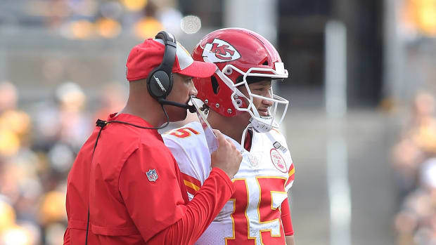 Sep 16, 2018; Pittsburgh, PA, USA; Kansas City Chiefs quarterbacks coach Mike Kafka (L) talks with quarterback Patrick Mahomes (15) against the Pittsburgh Steelers during the third quarter at Heinz Field. The Chiefs won 42-37. Mandatory Credit: Charles LeClaire-USA TODAY Sports