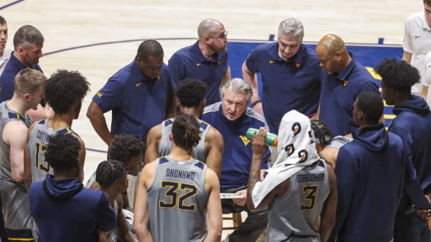 Jan 11, 2022; Morgantown, West Virginia, USA; West Virginia Mountaineers head coach Bob Huggins talks to his team during a timeout during the second half against the Oklahoma State Cowboys at WVU Coliseum.