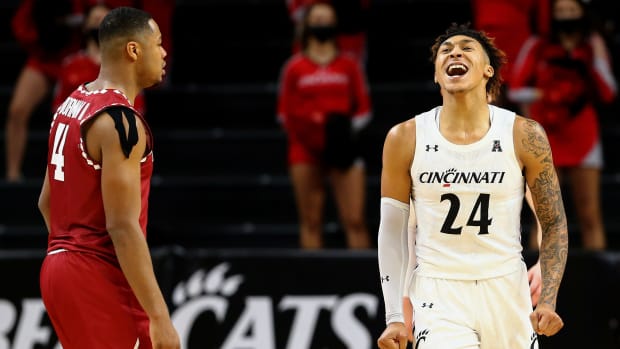 Cincinnati Bearcats guard Jeremiah Davenport (24) reacts to a turnover in the second half of an NCAA men's college basketball game against the Temple Owls, Friday, Feb. 12, 2021, at Fifth Third Arena in Cincinnati. The Cincinnati Bearcats won, 71-69. Temple Owls At Cincinnati Bearcats Feb 12