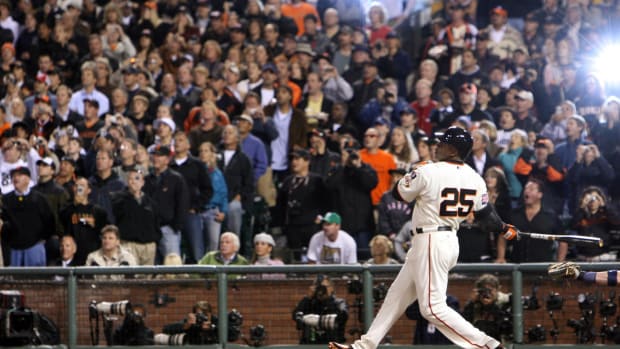Aug 7, 2007; San Francisco, CA, USA; San Francisco Giants left fielder Barry Bonds (25) hits his 756th career homerun off of Washington Nationals starting pitcher Mike Bacsik (not pictured) during the 5th inning at AT&T Park in San Francisco, CA. Bonds passed Hank Aaron (755 homeruns) to become the all-time career homerun leader. Mandatory Credit: Kyle Terada-USA TODAY Sports