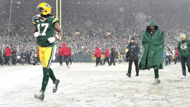 Davante Adams walking off the field with the Packers.