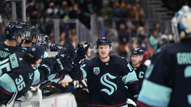 Jan 25, 2022; Seattle, Washington, USA; Seattle Kraken left wing Jared McCann (16) celebrates with the bench after scoring a goal against the Nashville Predators during the first period at Climate Pledge Arena. Mandatory Credit: Steven Bisig-USA TODAY Sports