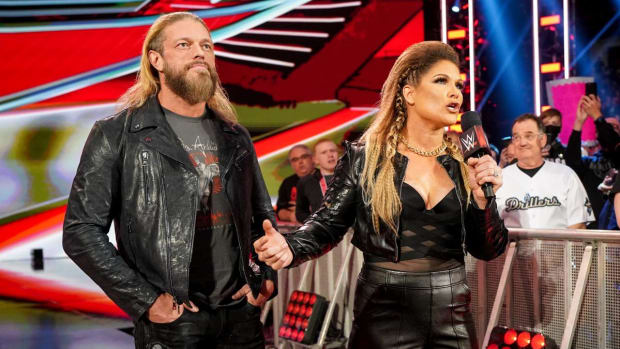 Edge and Beth Phoenix stand beside each other on Raw
