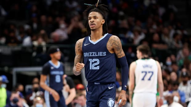 Jan 23, 2022; Dallas, Texas, USA; Memphis Grizzlies guard Ja Morant (12) reacts during the second half against the Dallas Mavericks at American Airlines Center.