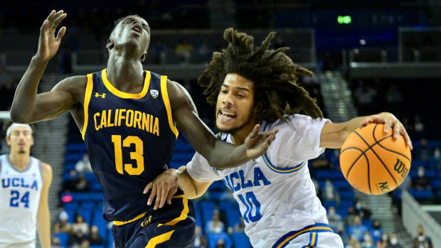 Cal's Kuany Kuany collides with UCLA's Tyger Campbell