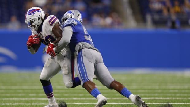 Aug 13, 2021; Detroit, Michigan, USA; Buffalo Bills running back Antonio Williams (28) runs after a catch against Detroit Lions defensive end Robert McCray (52) during the fourth quarter at Ford Field.