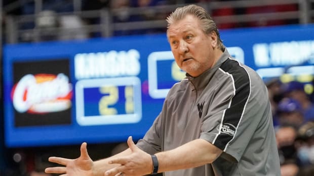 Jan 15, 2022; Lawrence, Kansas, USA; West Virginia Mountaineers head coach Bob Huggins gestures to players against the Kansas Jayhawks during the first half at Allen Fieldhouse.