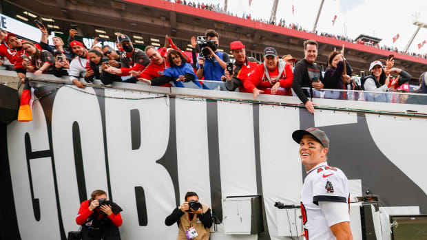 Jan 16, 2022; Tampa, Florida, USA; Tampa Bay Buccaneers quarterback Tom Brady (12) greets fans after beating the Philadelphia Eagles 31-15 in a NFC Wild Card playoff football game at Raymond James Stadium.