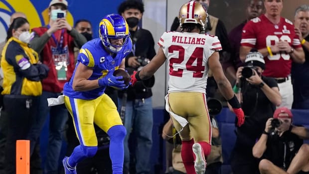 Los Angeles Rams' Cooper Kupp, left, catches a touchdown pass in front of San Francisco 49ers' K'Waun Williams during the second half of the NFC Championship NFL football game Sunday, Jan. 30, 2022, in Inglewood, Calif.