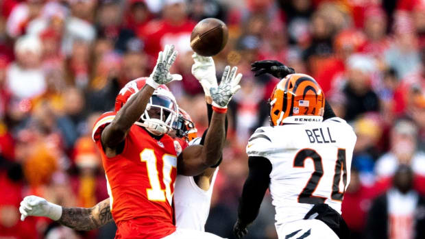 Cincinnati Bengals free safety Jessie Bates (30) knocks the ball away from Kansas City Chiefs wide receiver Tyreek Hill (10) and Cincinnati Bengals safety Vonn Bell (24) intercepts it in overtime of the AFC championship NFL football game, Sunday, Jan. 30, 2022, at GEHA Field at Arrowhead Stadium in Kansas City, Mo. Cincinnati Bengals defeated Kansas City Chiefs 27-24. Cincinnati Bengals At Kansas City Chiefs Jan 30 Afc Championship 103