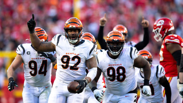 Bengals defensive end B.J. Hill (92) celebrates after intercepting a pass from Chiefs quarterback Patrick Mahomes in the fourth quarter. Syndication The Enquirer