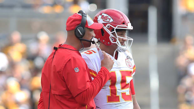 Sep 16, 2018; Pittsburgh, PA, USA; Kansas City Chiefs quarterbacks coach Mike Kafka (L) talks with quarterback Patrick Mahomes (15) against the Pittsburgh Steelers during the third quarter at Heinz Field. The Chiefs won 42-37. Mandatory Credit: Charles LeClaire-USA TODAY Sports