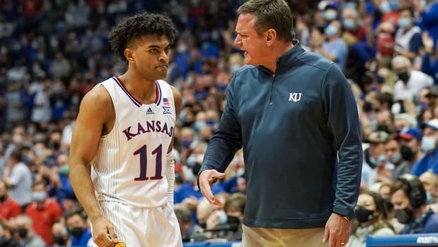 Jan 24, 2022; Lawrence, Kansas, USA; Kansas Jayhawks guard Remy Martin (11) talks with head coach Bill Self against the Texas Tech Red Raiders during the second half at Allen Fieldhouse. Mandatory Credit: Denny Medley-USA TODAY Sports
