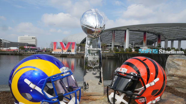 Los Angeles Rams and Cincinnati Bengals helmets are seen with a Vince Lombardi trophy at SoFi Stadium. The Rams and Bengals will play in Super Bowl LVI on Feb. 13, 202.