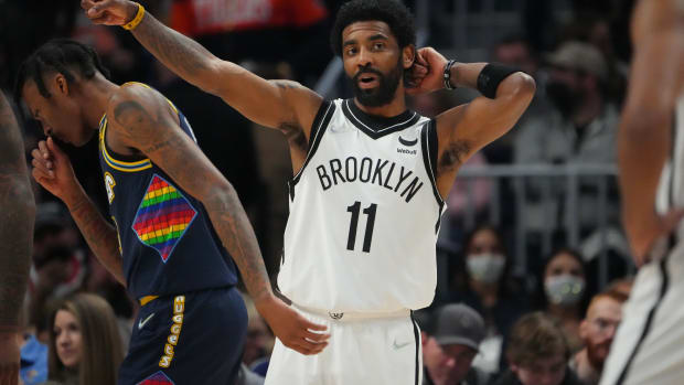 Feb 6, 2022; Denver, Colorado, USA; Brooklyn Nets guard Kyrie Irving (11) calls out in the second quarter against the Denver Nuggets at Ball Arena. Mandatory Credit: Ron Chenoy-USA TODAY Sports