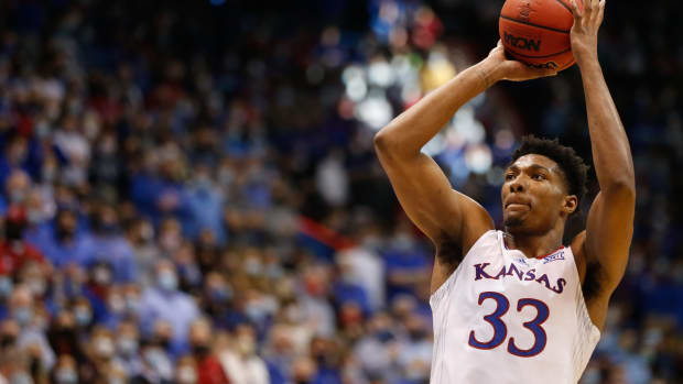 Kansas senior forward David McCormack (33) shoots a free throw after a technical foul is called on Baylor during the second half of Saturday's game inside Allen Fieldhouse.