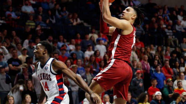 Alabama Crimson Tide guard Jaden Shackelford (5) drives to the basket as Mississippi Rebels guard Tye Fagan (14) defends during the first half at The Sandy and John Black Pavilion at Ole Miss.