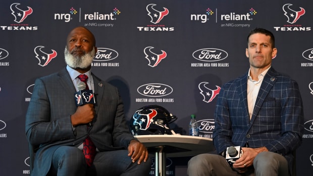 Feb 8, 2022; Houston, TX, USA; Houston Texans new head coach Lovie Smith (left) and general manager Nick Caserio (right) speak during the introductory press conference at NRG Stadium. Mandatory Credit: Maria Lysaker-USA TODAY Sports