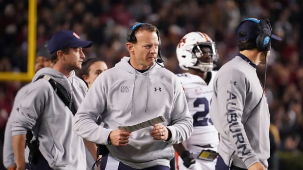 Auburn head coach Bryan Harsin walks near the sideline during a timeout in the first half of an NCAA college football game against South Carolina on Nov. 20, 2021, in Columbia, S.C.