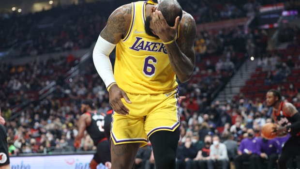 Feb 9, 2022; Portland, Oregon, USA; Los Angeles Lakers forward LeBron James (6) reacts after being hit in the head by Portland Trail Blazers forward Justise Winslow (26) in the first half at Moda Center. Mandatory Credit: Jaime Valdez-USA TODAY Sports