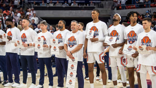 Auburn Tigers head coach Bruce Pearl and his players honor cancer victims during the AUTLIVE game as Auburn Tigers men's basketball takes on Texas A&M Aggies at Auburn Arena in Auburn, Ala., on Saturday, Feb. 12, 2022. Auburn Tigers lead Texas A&M Aggies 33-18 at halftime.