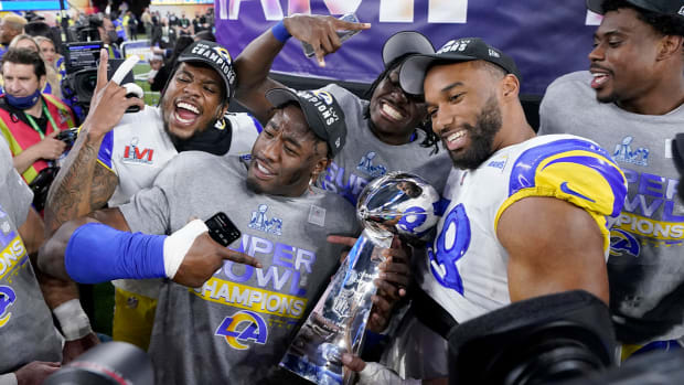 Los Angeles Rams players celebrate with the Lombardi Trophy after defeating the Cincinnati Bengals in the NFL Super Bowl 56 football game Sunday, Feb. 13, 2022, in Inglewood, Calif.