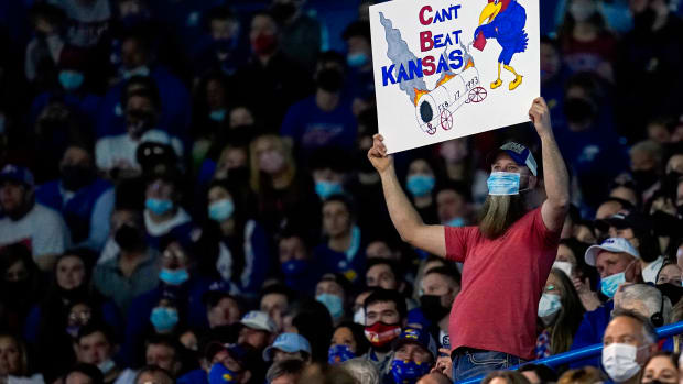 Feb 12, 2022; Lawrence, Kansas, USA; A Kansas Jayhawks fan holds a sign during the second half against the Oklahoma Sooners at Allen Fieldhouse. Mandatory Credit: Jay Biggerstaff-USA TODAY Sports