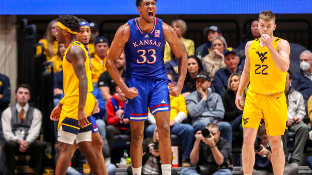Feb 19, 2022; Morgantown, West Virginia, USA; Kansas Jayhawks forward David McCormack (33) celebrates after a made basket during the second half against the West Virginia Mountaineers at WVU Coliseum. Mandatory Credit: Ben Queen-USA TODAY Sports